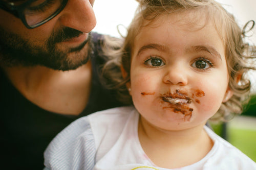 baby-girl-eating-chocolate-all-around-her-face - Mustela Australia - 1