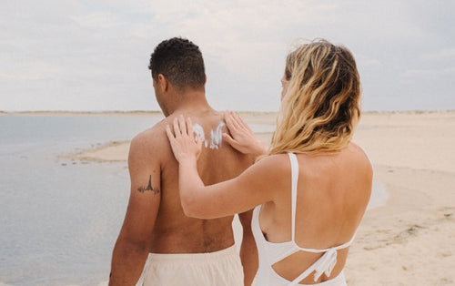 woman-applying-suncreen-to-her-partner-back - Mustela Australia - 1