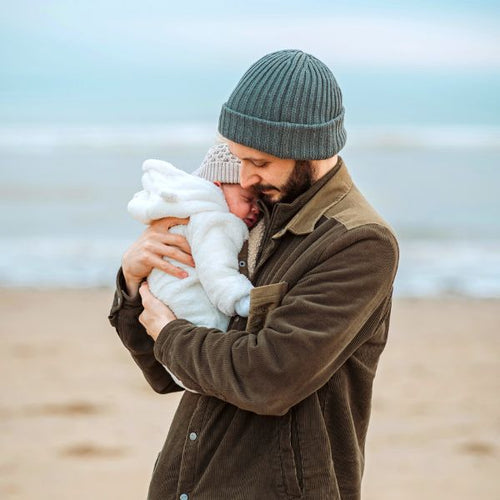 dad holding baby at the beach - Mustela Australia - 1